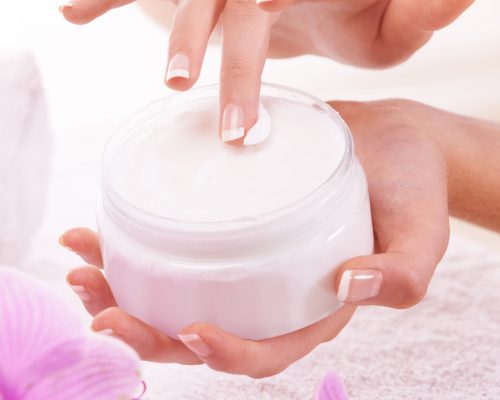 Skincare is important to her. Cropped shot of a woman holding a jar of hand cream